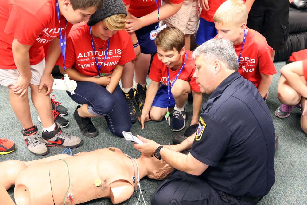 air camp students learning cpr