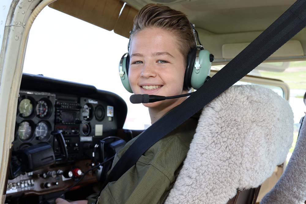 air camp student in plane