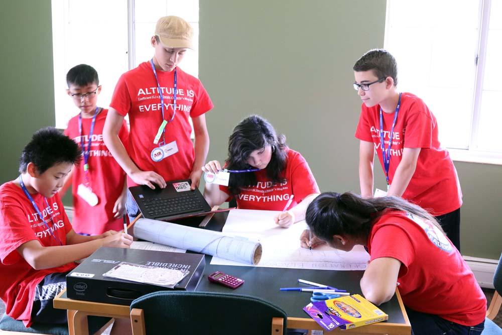 air camp students writing on a map