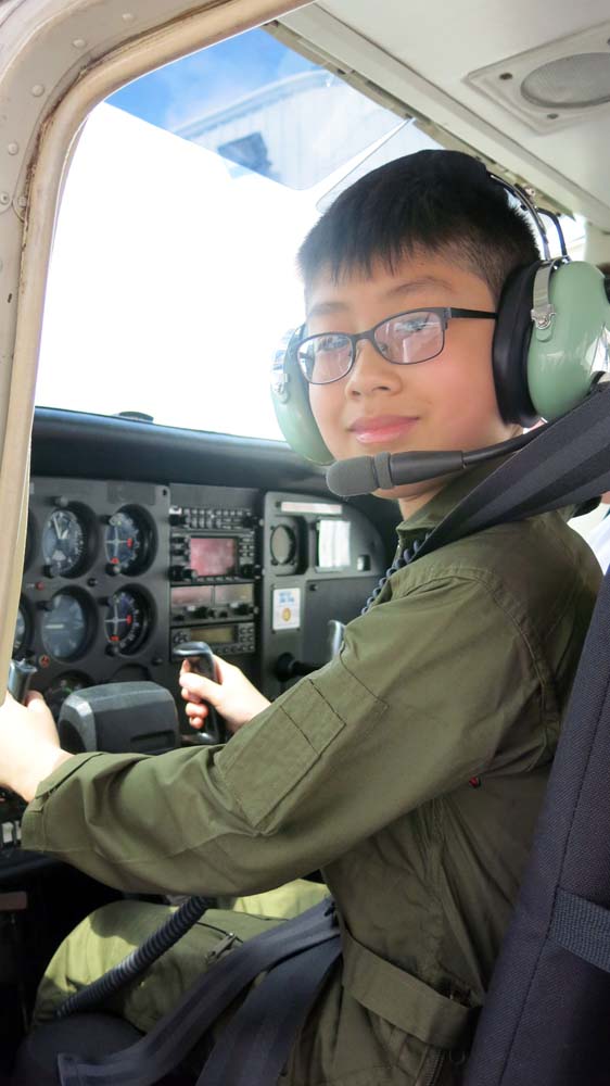air camp student in plane