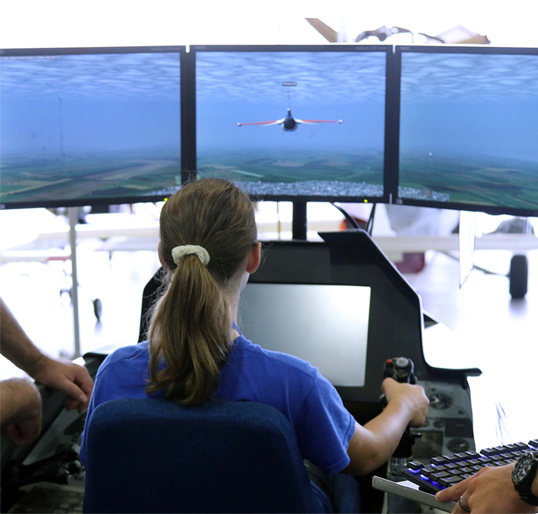 kids on an air plane simulator